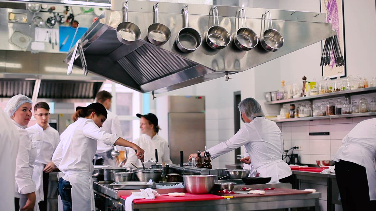 Chefs at work on a commercial kitchen line